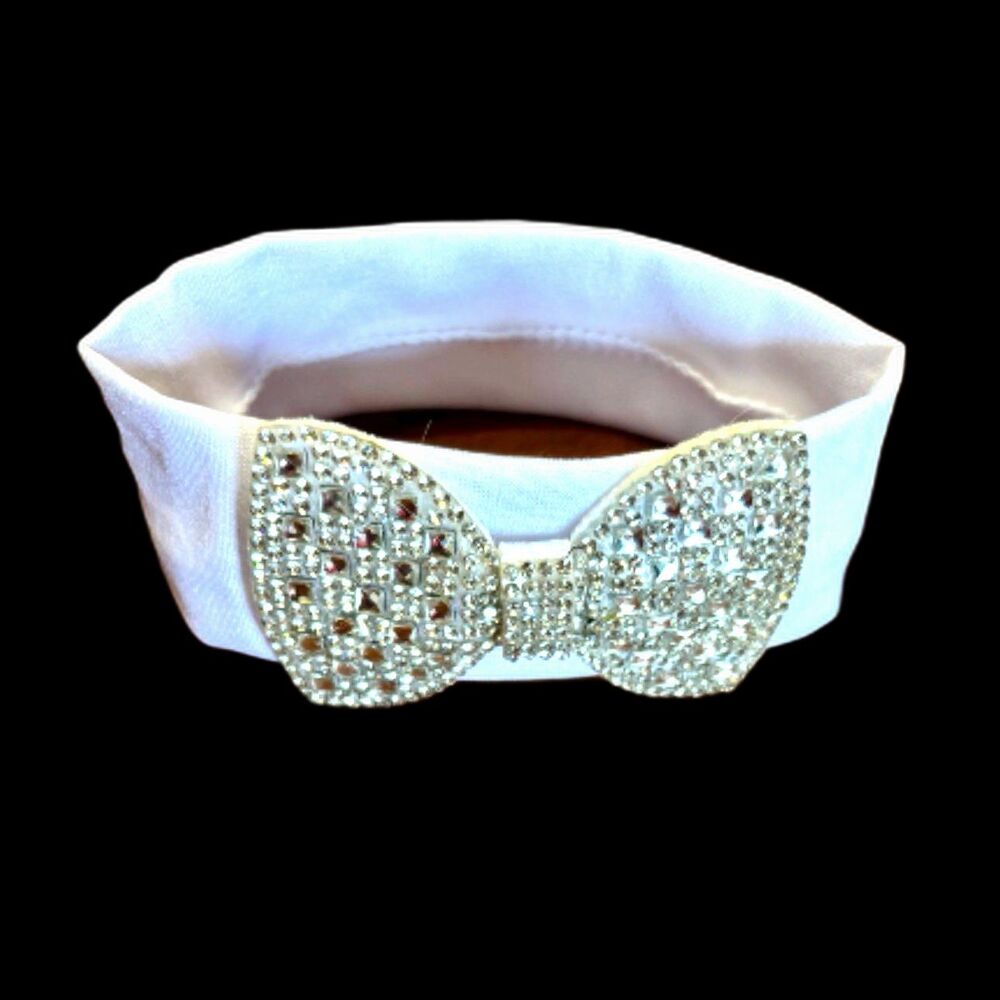 Infant White Fabric Headband Adorned With A Sparkling Rhinestone Bow